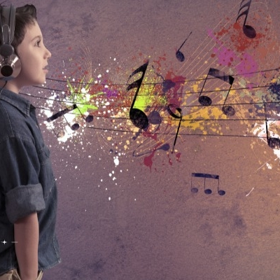 A teenager listens to music on headphones while conjuring up colorful, artistic views of the sounds they are learning.