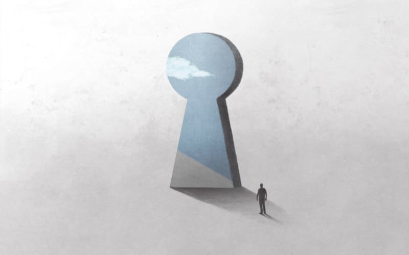 A human stands at virtual key hole door, searching for the answer to "Who am I?"